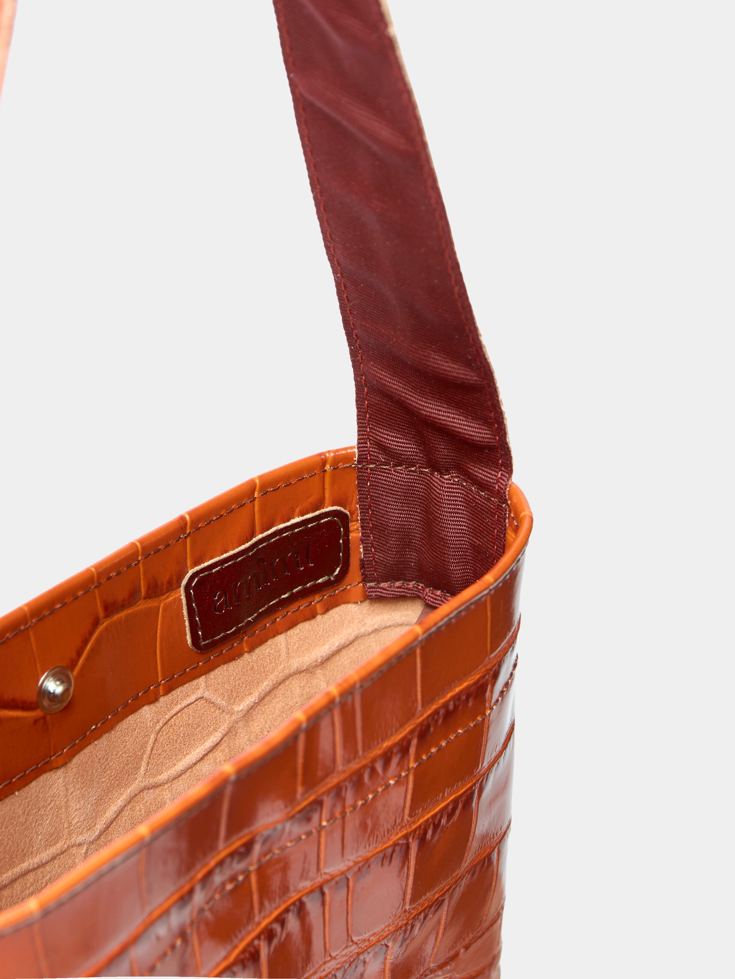 Lea Bag Cocco Orange dettaglio interno fodera beige e logo Amimi