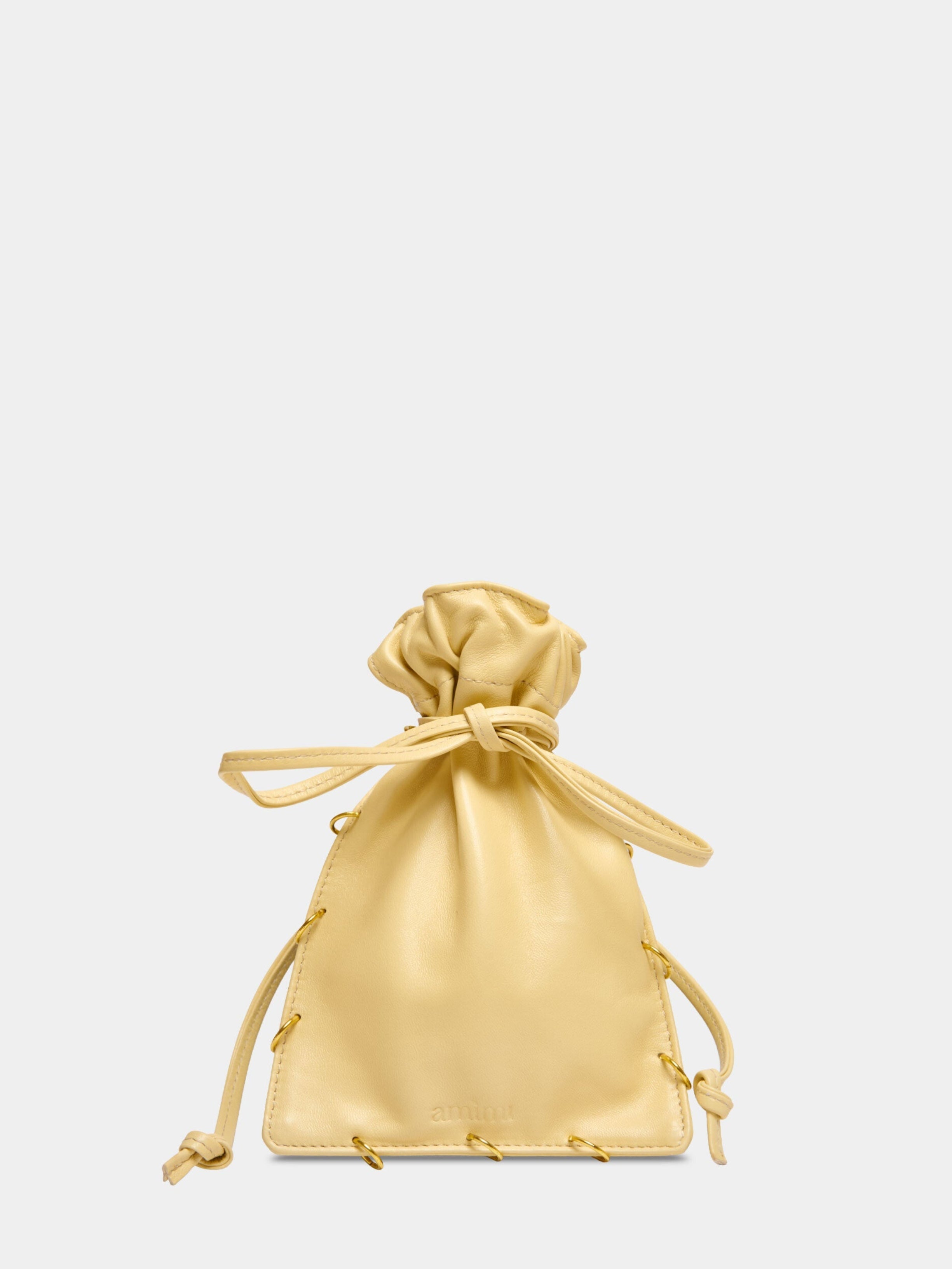 Maria Bag Burro Piercing borsa a sacchetto in pelle giallo burro Amimi Milano